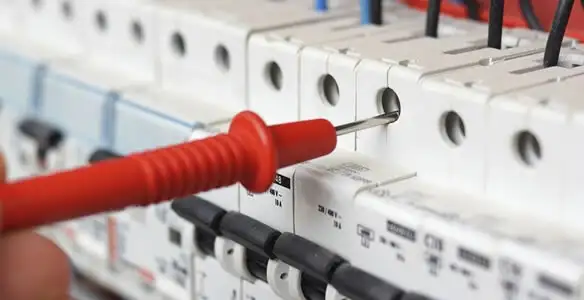 Electrical contractor testing circuit breakers during electrical repair in Erlanger, KY