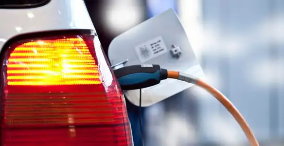 Electric car plugged into EV charger after professional installation in Cincinnati, OH