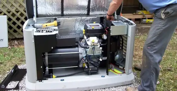 generator installation service showing technician connecting and configuring generator components in Cincinnati, OH