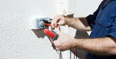Electrician performing home electrical outlet and wiring inspection in Cincinnati, OH