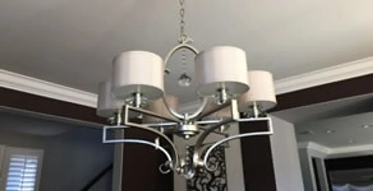 Modern chandelier installation with multiple light fixtures in Cincinnati, OH