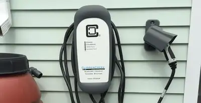 Outdoor electric vehicle charger installation on residential wall in Cincinnati, OH