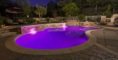pool light installation and repair services illuminating a residential swimming pool in Cincinnati, OH