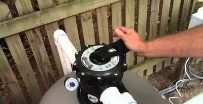 pool pumps service showing professional adjustment of pool pump control system in Cincinnati, OH