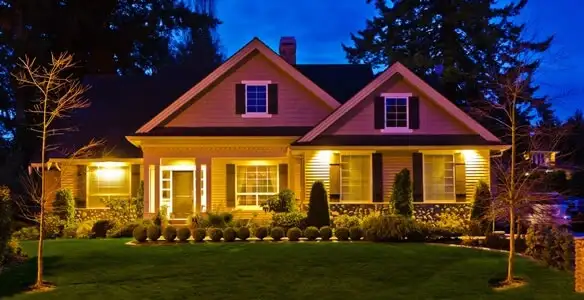 security light installation services illuminating a residential exterior at night in Cincinnati, OH