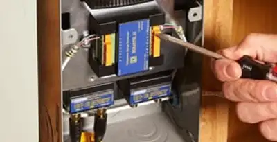Whole home surge protection device being installed by a licensed electrician to protect electrical systems in Cincinnati, OH